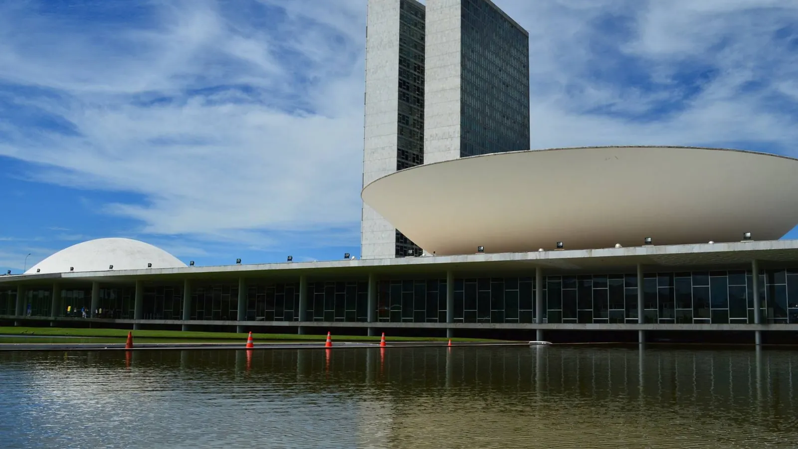 The twin towers and two domes of Brazil's National Congress in Brasília, with the reflecting pool in front