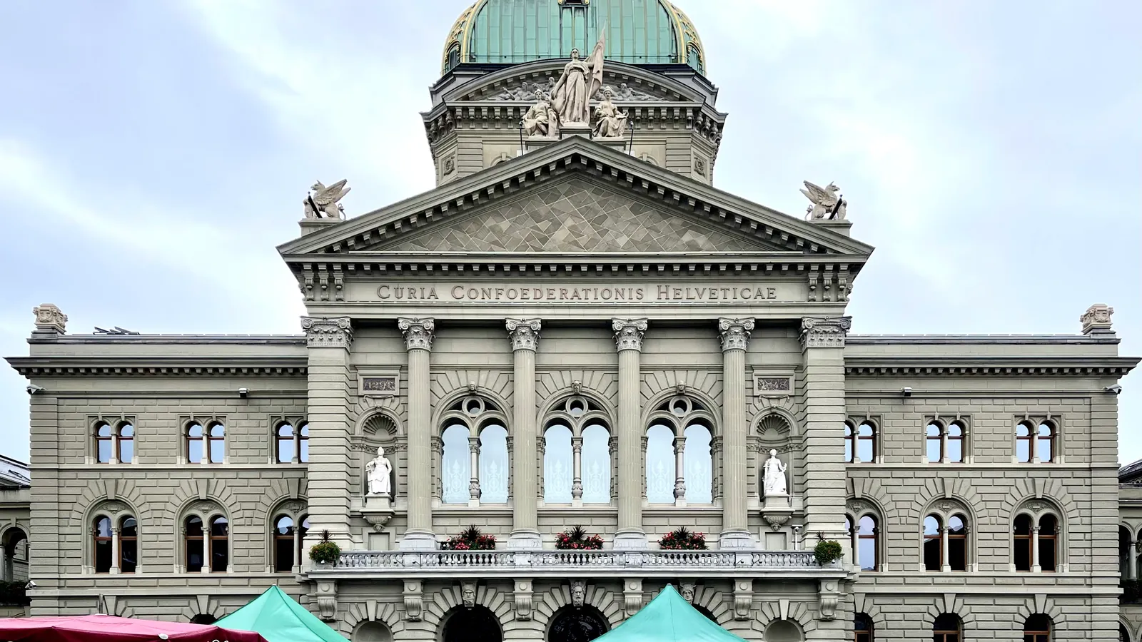 The domed stone front of the Federal Palace in Bern